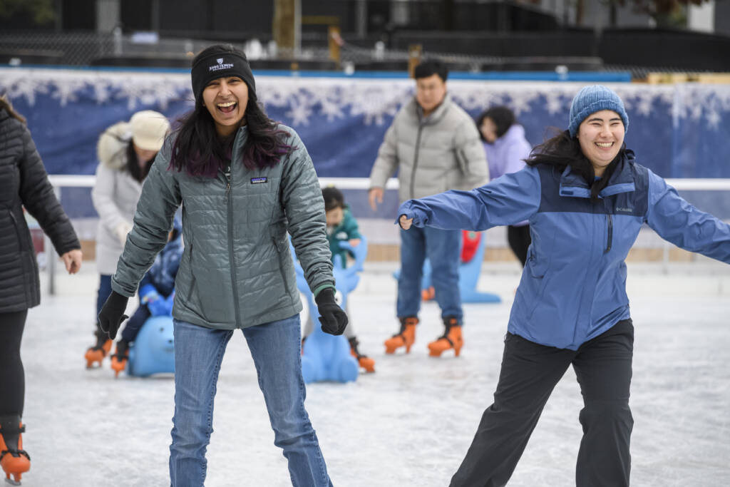 Ice skaters at the Johns Hopkins ice rink on the Homewood Campus